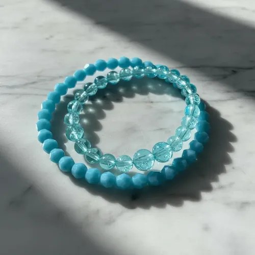 Pulseras X 2 Elásticas Con Cuentas Plastica Consultar Color Celeste 19 Cm
