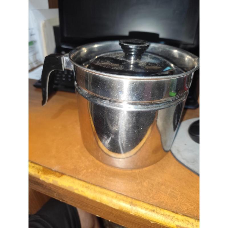 antigua lechera de acero inoxidable